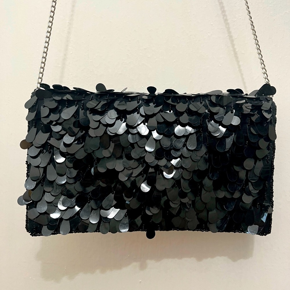 Fun and Flirty Little Black Clutch, brand new, never been used. Removable chain.